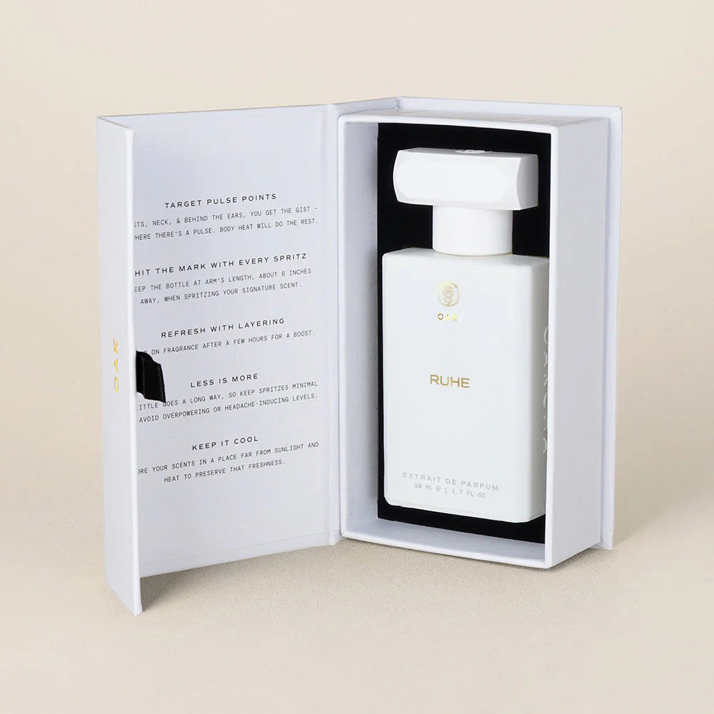 a bottle of perfume in a white box