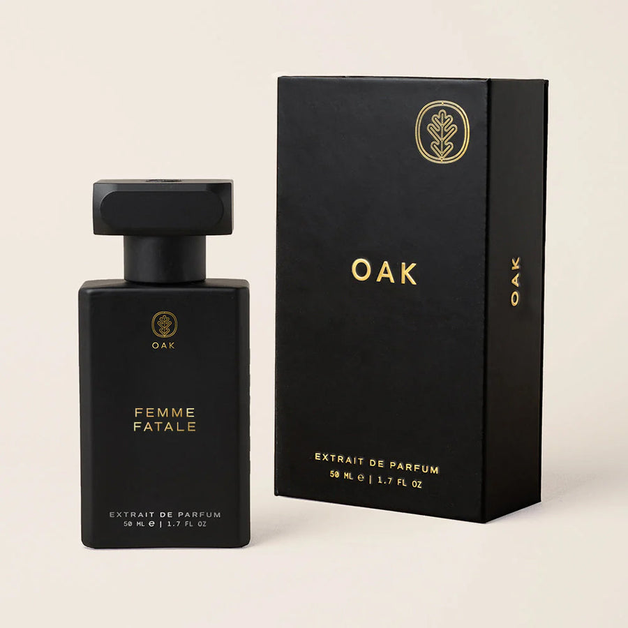 a bottle of perfume next to a box