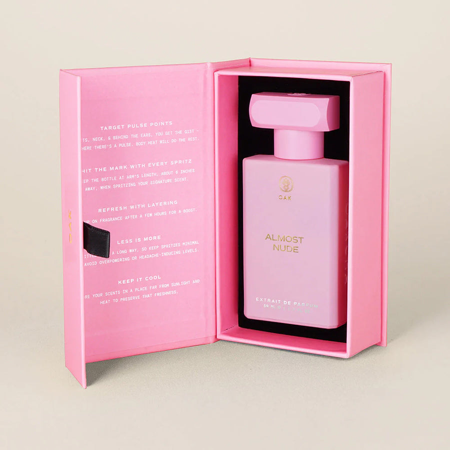 a pink box with a bottle inside of it